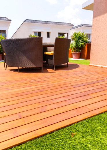 Solid timber wood decking installation in outdoor patio area