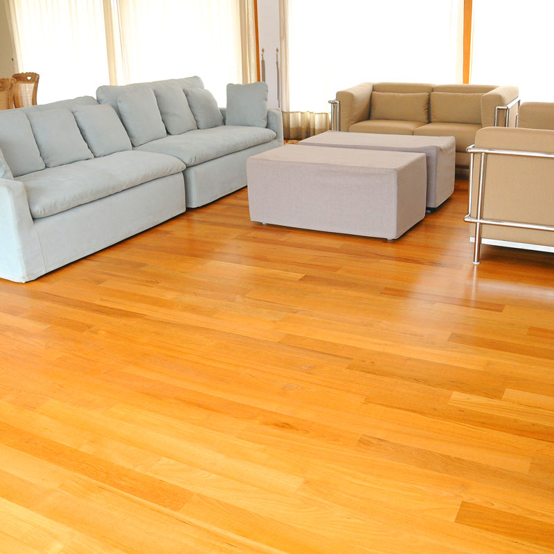 Solid wood flooring installation in modern home interior