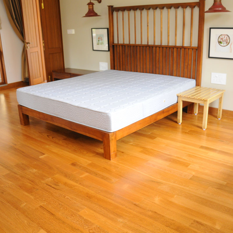 Natural solid wood floor boards installed in room area