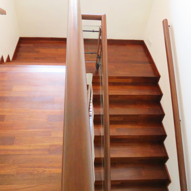 Solid wooden staircase in modern interior with natural timber finish
